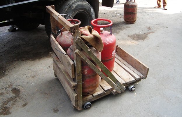 Ball bearing cart transporting gas cylinders