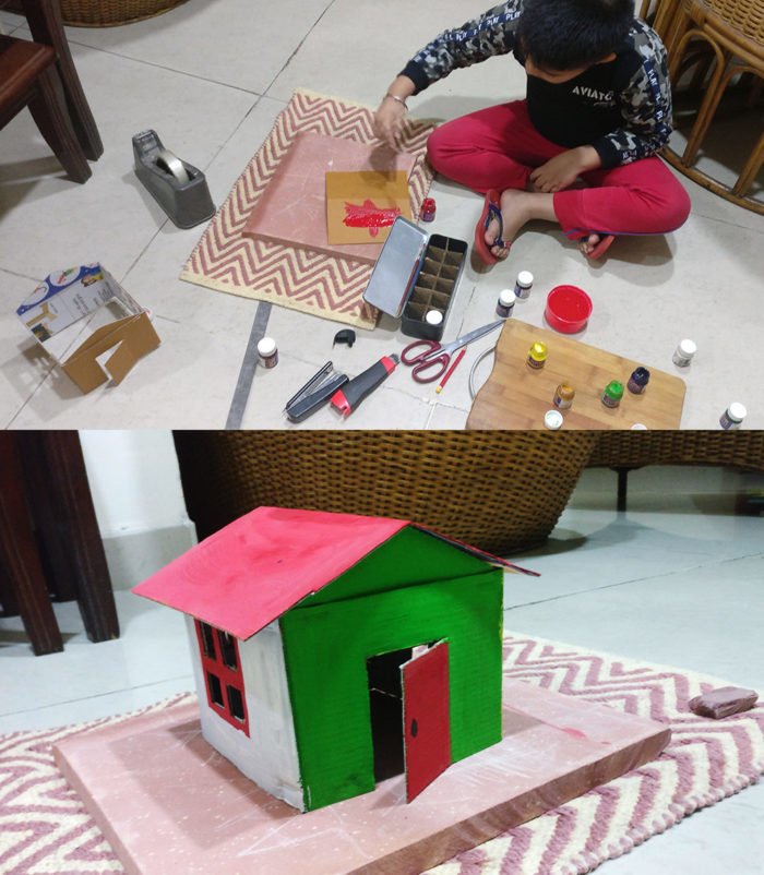 Advay creating his cardboard Mera-Merir house